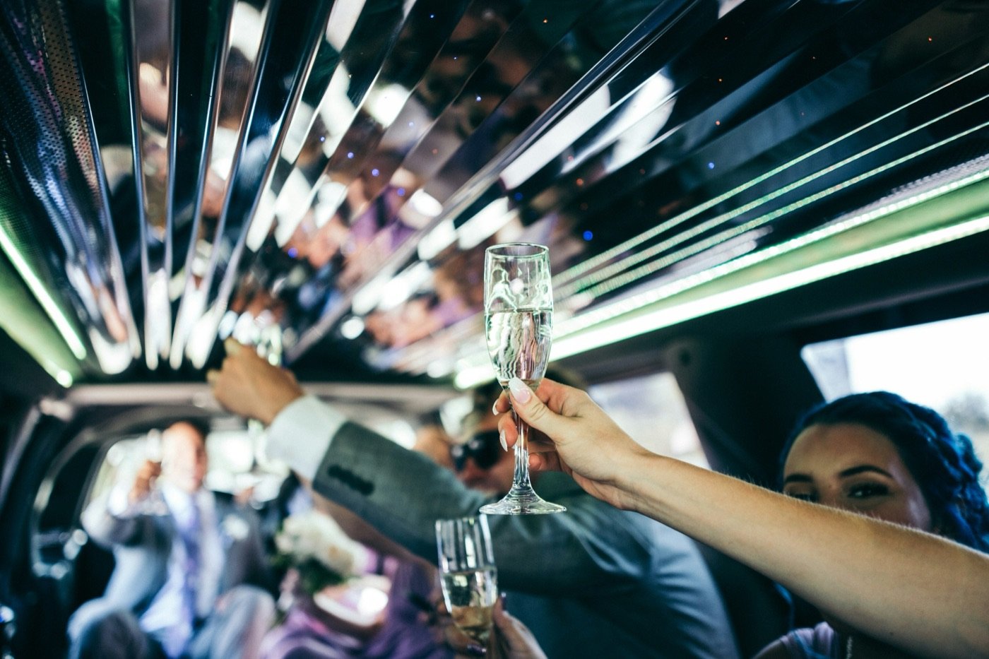 Champagne toast inside a stretch limousine