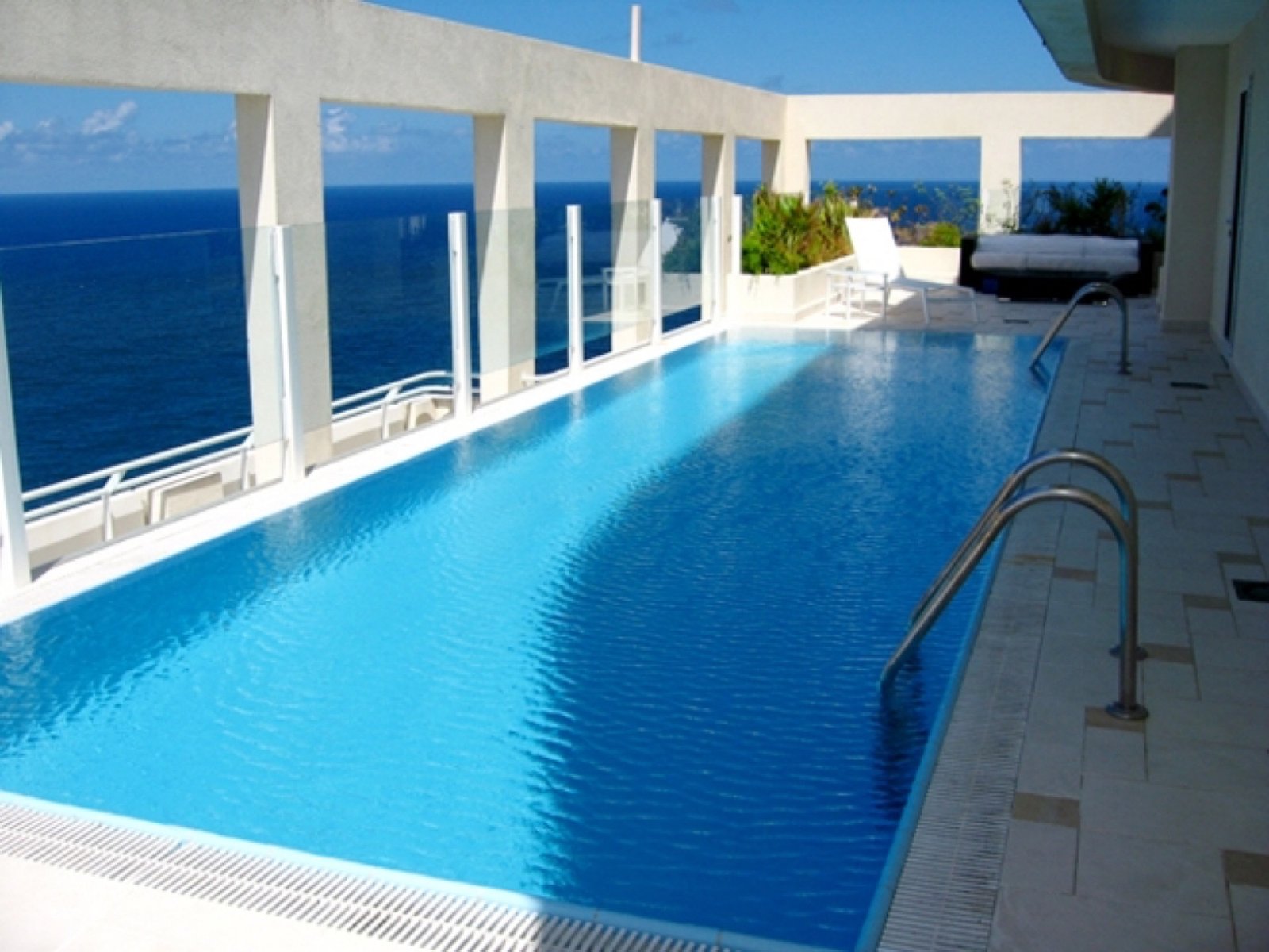Rooftop penthouse pool overlooking the sea in Havana